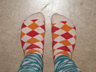 Feet showing fancy socks