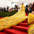 Rihanna owned the red carpet in a massive cape at the MET Gala 2015