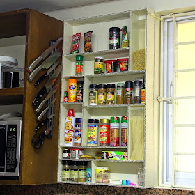 Mounted cardboard spice rack.