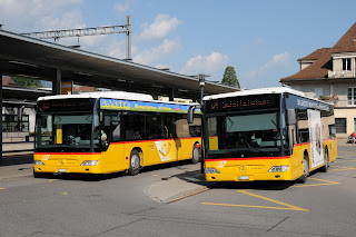 Two Swiss Postauto Busses