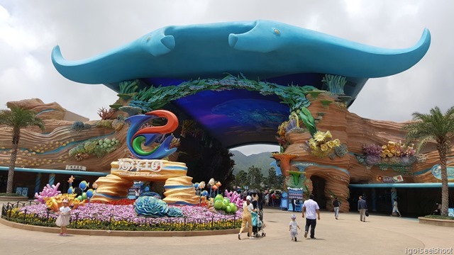 Chimelong Ocean Kingdom in Zhuhai - Ocean Avenue at the entrance with giant LED screens under the manta ray shaped roof.