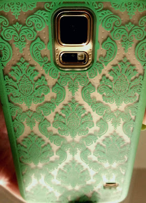 clear phone case with mint damask on gold phone