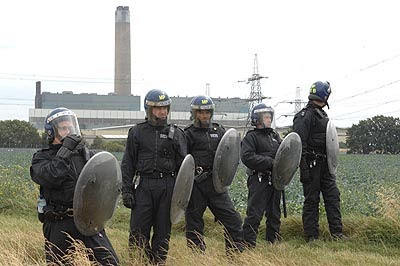 Police defending the existing Kingsnorth power station during the 2008 Climate Camp protests.