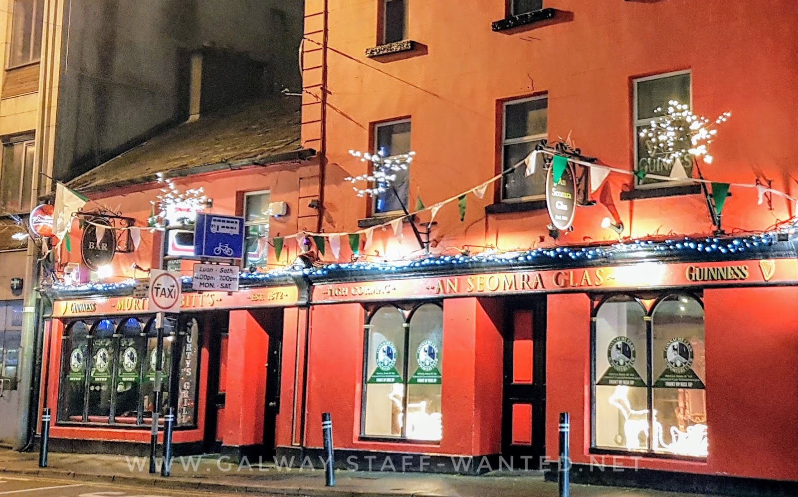 Bright red pub, extending over two or more buildings in central Galway city:   Tigh Cormac - An Seomra Glas ie The Green Room