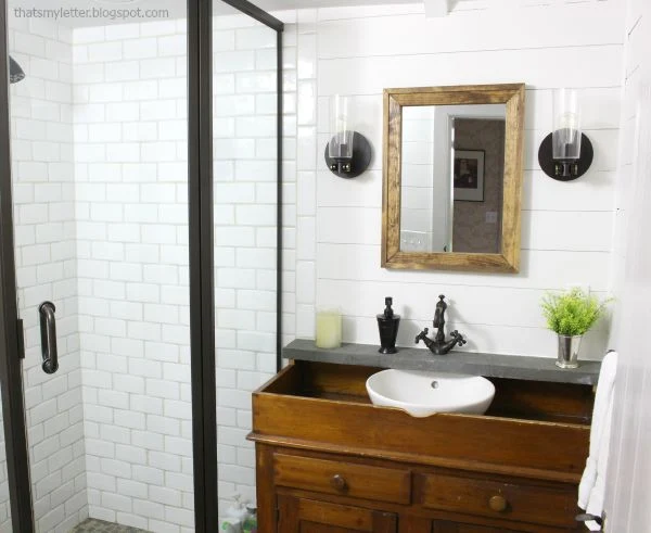 white tile dark metal bathroom