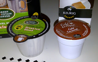 Shows a Vue Pack next to a K-cup for size comparision