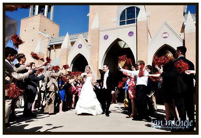 bride and groom pompoms outside church