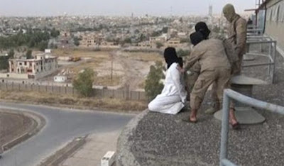 A gay man is about to be thrown off a building rooftop by ISIS fighters in Iraq in August 2015.
