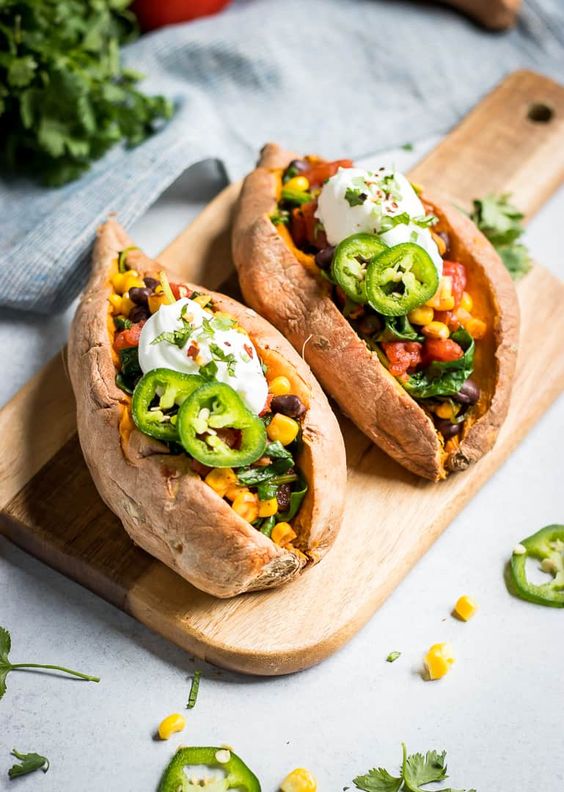 Take your sweet potatoes to the next level. These simple Mexican Stuffed Sweet Potatoes are an easy weeknight meal that is full of beans and veggies!