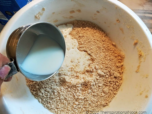 Add milk to caraway cake batter