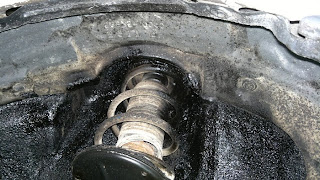 Front shock absorber on a Toyota Starlet