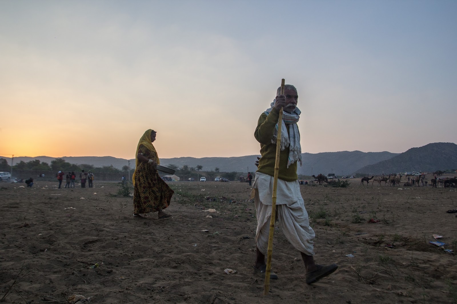 The working herder and his wife at Pushkar Festival