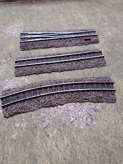 The railway tracks by Ironclad Miniatures fully painted