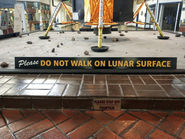 Do not walk on lunar surface. Exhibit at shopping mall. Alamogordo, New Mexico. August 2023. Photo credit: Mzuriana.