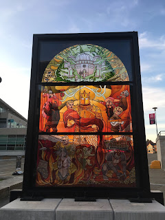 Glass of thrones stained glass window showing the house of lannisters