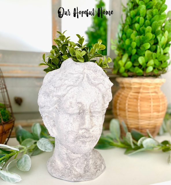 DIY cement Grecian urn planter filled with faux boxwood