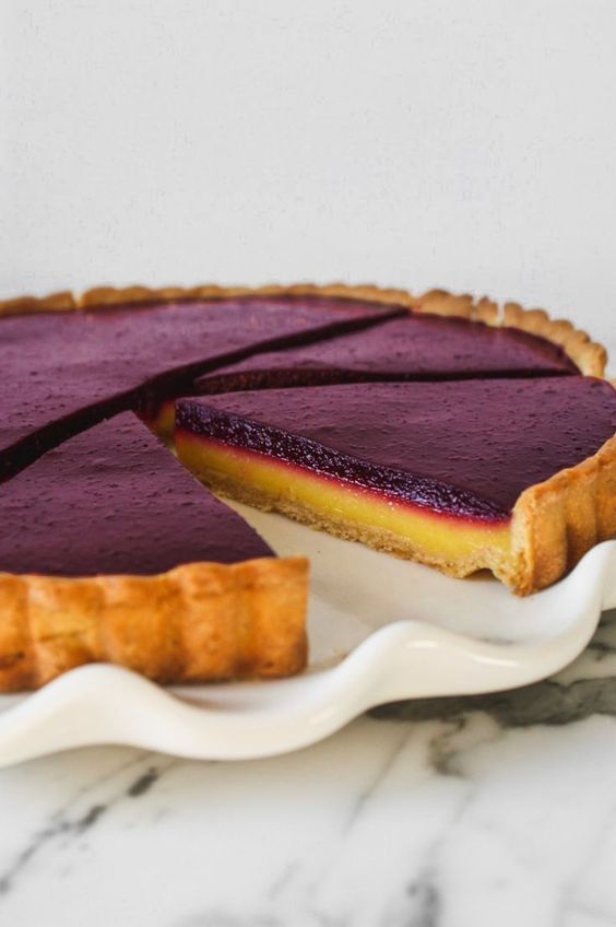 This layered, summery tart is as stunning as it is delicious. Naturally sweetened, this tart recipe features a vibrant lemon curd layer foll...