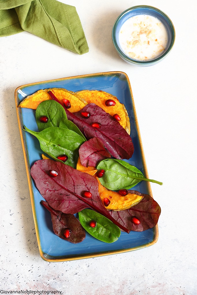 Insalata con zucca, spinacini e melagrana