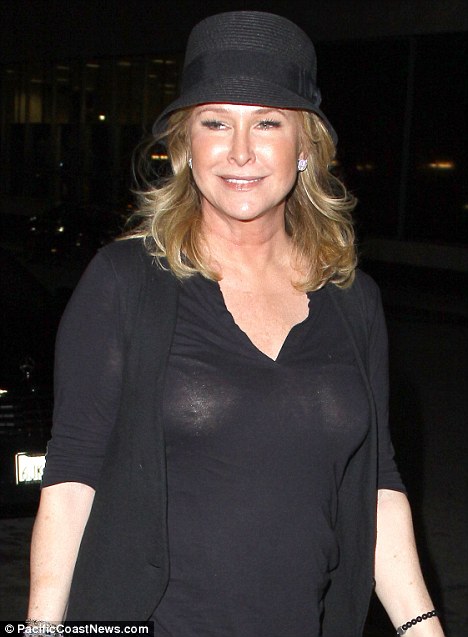 Kathy stepped out braless in a black blouse She had clearly worn nothing 