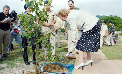 Margaret Thatcher planting a tree sapling