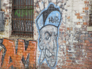 Graffiti Face Near Globe Building Detroit