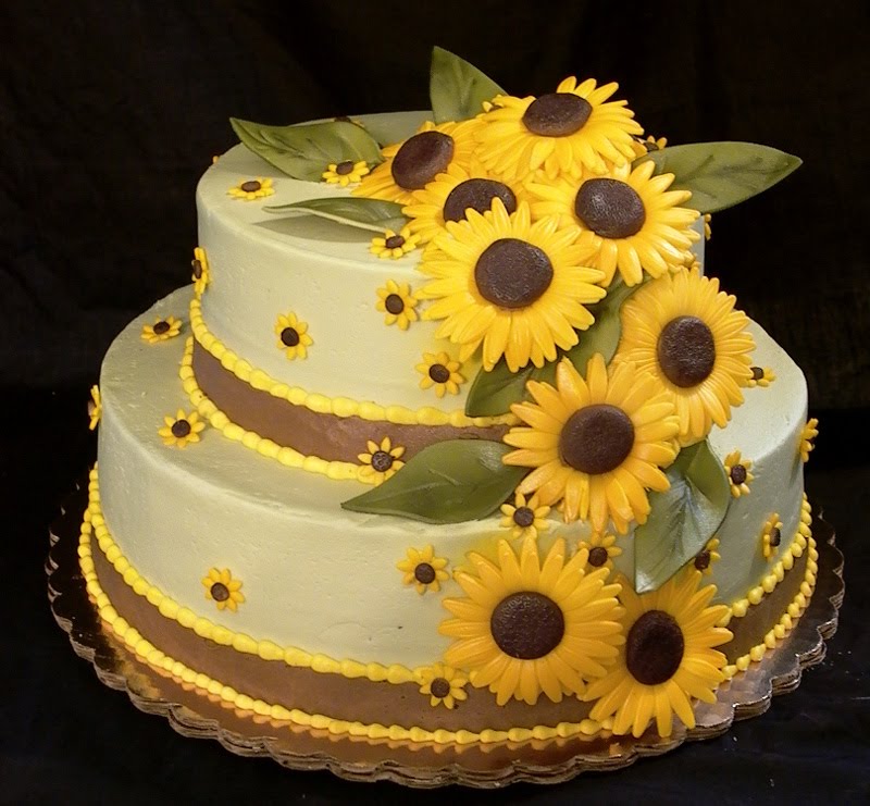 Elegant two tier square wedding cake with sunflowers