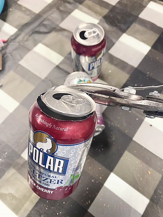 cutting top of soda can