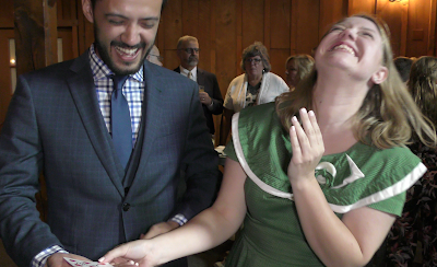 Image of a wedding reception where the guests are enjoying the "Magic of Joe Ferranti Boston's Best Clsoe-Up Magician.i"