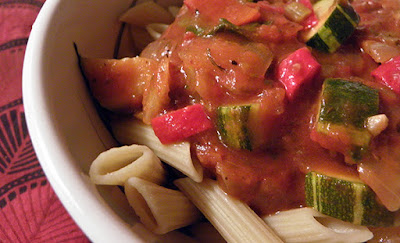 closeup of pasta with heirloom tomato sauce