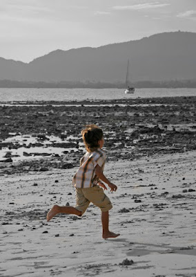 Our boy running on the beach at The Beach Bar