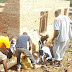 University Students Construct House for Genocide Survivor