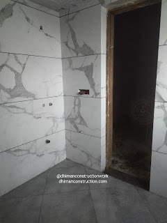 Small bathroom tile design with black and white tiles