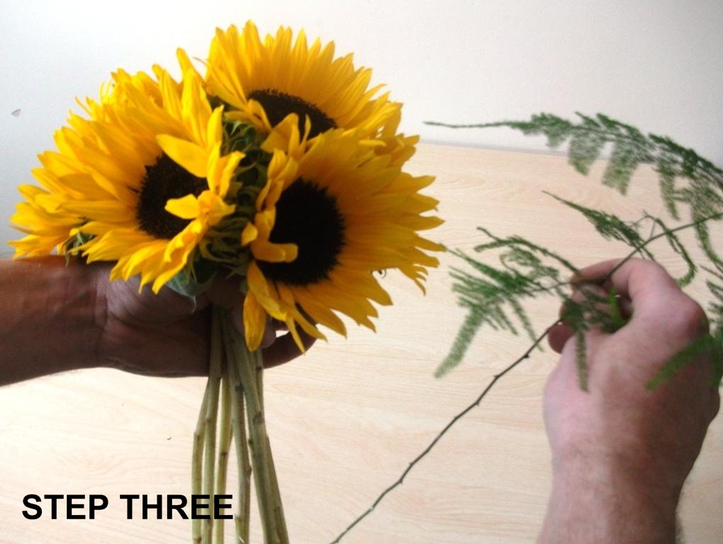 Step 2 continue to add sunflowers to form a dome style bouquet as in 