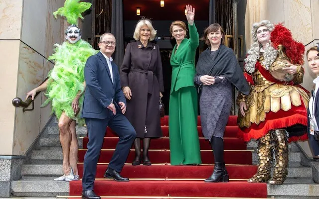 Queen Camilla and First Lady Elke Büdenbender visited the Komishe Oper in Berlin. Green blazer and brown wool coat