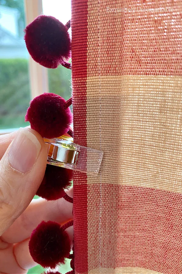 Using a clip to fasten Pom Pom Trim In Place To Sew