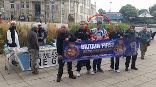 Tom Mair holding Britain First banner