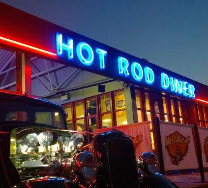 Exterior of Hot Rod Diner in Gravesend/Northfleet, with the restaurant name lit up in neon blue lights