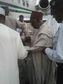 Photo Of 92-Year-Old Shehu
Shagari Being Helped By His
Aides To Board A Plane