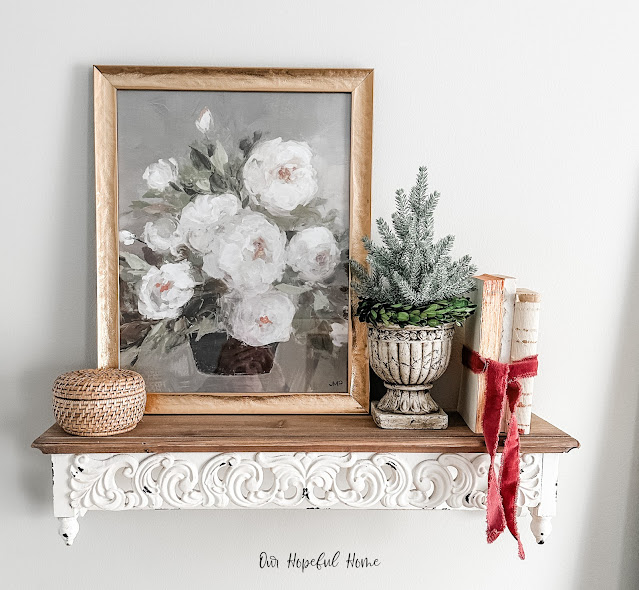 white floral wall art shelf decor vintage books velvet ribbon