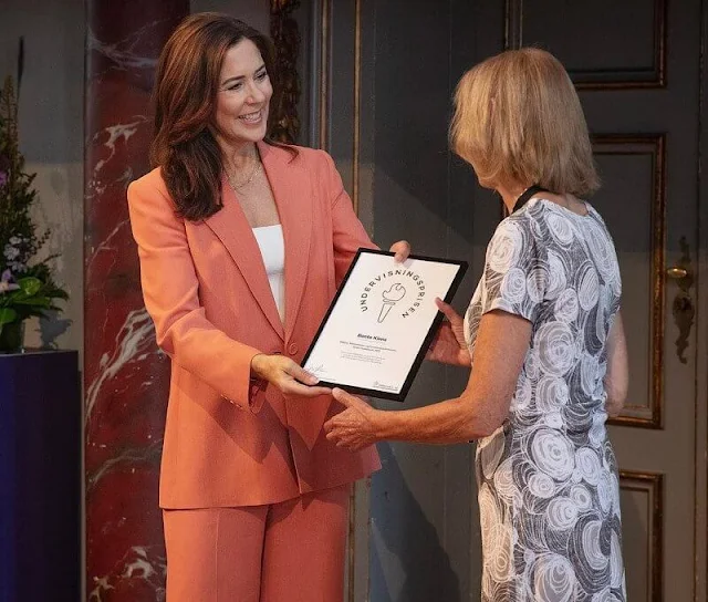 Crown Princess Mary wore a coral tailored jacket by Scanlan Theodore, and coral wide leg trousers by Scanlan Theodore