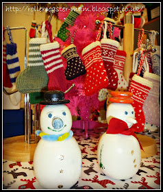 hand knitted mini Christmas stockings and mini wooden snowmen