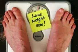 Healthy weight loss plan. Two feet on the scale