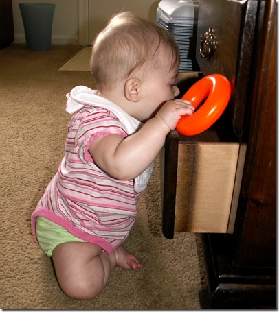 Elaine 6 months playing in drawer