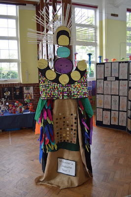 Replica Mourner's Costume stands in the middle of a school hall