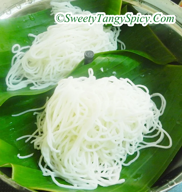 Placing Idiyappam on steaming surface, preparing for the steaming process.