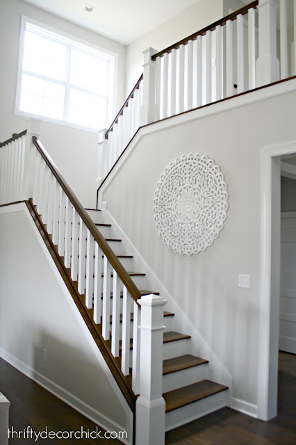 White and stained stairs with balusters