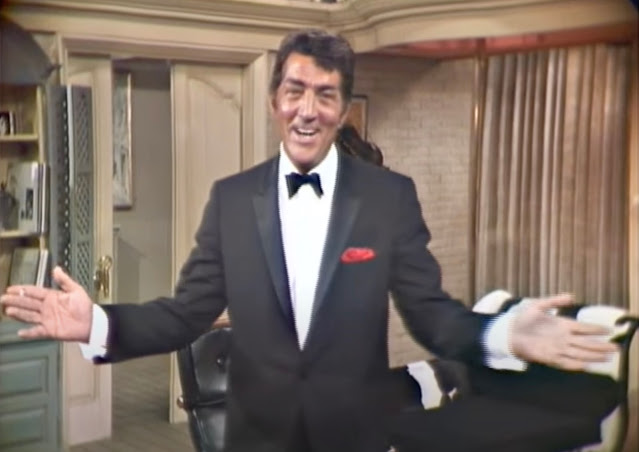Screenshot of video of Dean Martin performing in a tux on his TV show in 1966