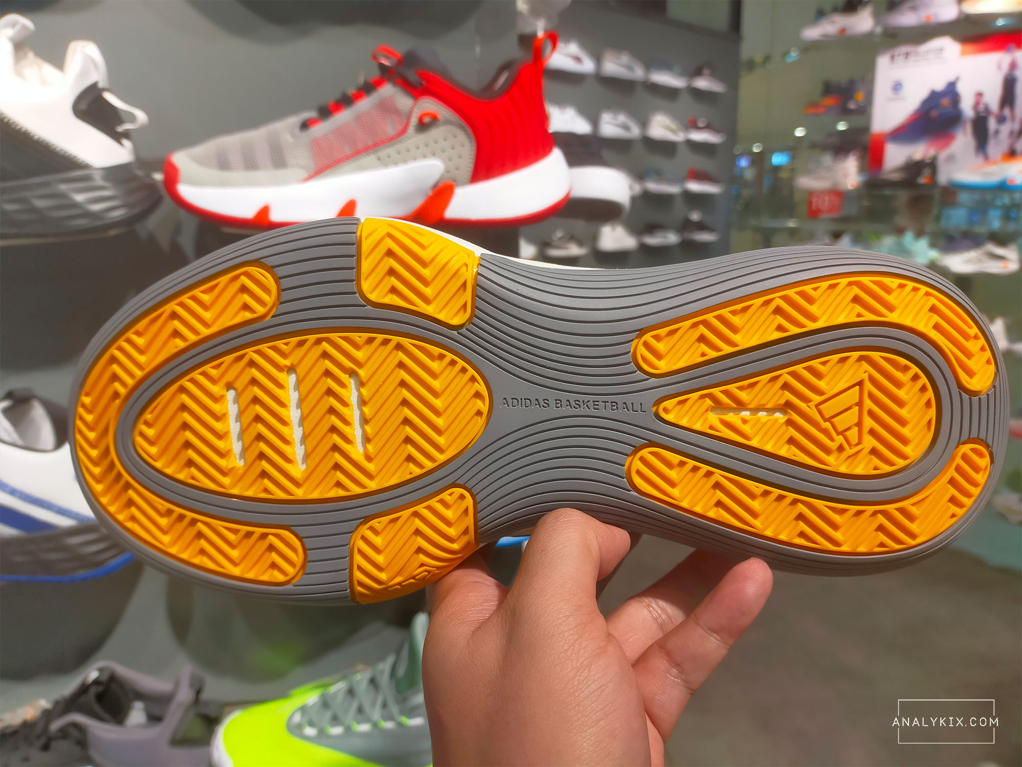 outsole of adidas Bounce Legends white yellow colorway