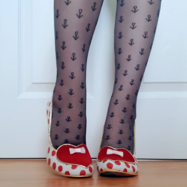 wearing navy anchor socks with red spotty shoes with hearts and bows