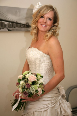 The Bridal Bouquet was tied in satin ribbon and lace with a vintage button